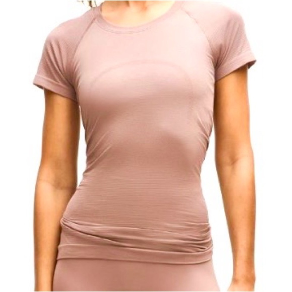 Lululemon Pink Short Sleeve Tee. Size 10. Hip length. Great condition.